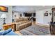 Spacious living room with modern decor, stylish rug, and comfortable seating arrangement at 2901 N Glencoe St, Denver, CO 80207