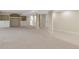 Spacious basement with built-in shelving and open floor plan leading to laundry at 20271 E Lake Ave, Centennial, CO 80016