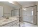 Bathroom featuring neutral countertops, a framed mirror and shower-tub combination at 20271 E Lake Ave, Centennial, CO 80016
