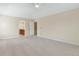Spacious bedroom featuring neutral carpet and wall paint, bright lighting, and connecting bathroom at 20271 E Lake Ave, Centennial, CO 80016