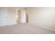 Bedroom showcasing neutral walls and carpet, bright lighting, closet and connecting bathroom at 20271 E Lake Ave, Centennial, CO 80016
