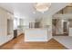 Bright kitchen featuring stainless steel appliances, an island with bar seating, and a smooth transition to living area at 20271 E Lake Ave, Centennial, CO 80016