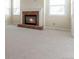 Bright living room showcasing brick fireplace and large windows at 20271 E Lake Ave, Centennial, CO 80016