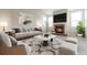 Staged living room featuring a fireplace, large windows, and contemporary decor at 20271 E Lake Ave, Centennial, CO 80016