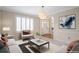 Living room with stylish decor and neutral colors and entry view at 20271 E Lake Ave, Centennial, CO 80016