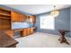 Spacious office area with built-in desk, cabinets, and ample natural light at 20271 E Lake Ave, Centennial, CO 80016