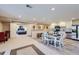Open basement with a dining area and fully equipped kitchen, adjacent to a comfortable bedroom space at 5350 Clearbrooke Ct, Castle Rock, CO 80104