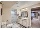 Bathroom featuring a glass door shower, elegant vanity with marble countertop, and modern fixtures at 5350 Clearbrooke Ct, Castle Rock, CO 80104