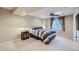 Cozy bedroom with soft lighting, carpet flooring, and a window for natural light, creating a warm ambiance at 5350 Clearbrooke Ct, Castle Rock, CO 80104