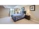 Comfortable bedroom features neutral decor, a window bench, and ample natural light at 5350 Clearbrooke Ct, Castle Rock, CO 80104