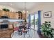 Cozy breakfast nook with access to the deck and views of the surrounding landscape at 5350 Clearbrooke Ct, Castle Rock, CO 80104