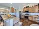Modern kitchen with stainless steel appliances, granite countertops, and hardwood floors at 5350 Clearbrooke Ct, Castle Rock, CO 80104