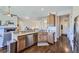 Well-equipped kitchen featuring granite counters, stainless appliances, and hardwood floors at 5350 Clearbrooke Ct, Castle Rock, CO 80104