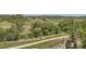 Scenic landscape showcasing lush greenery, mature trees, and a charming fence at 5350 Clearbrooke Ct, Castle Rock, CO 80104