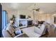 Comfortable living room with a stone fireplace, plush seating, and a ceiling fan at 5350 Clearbrooke Ct, Castle Rock, CO 80104