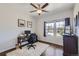 Bright office space with wood floors, a ceiling fan, and large windows offering views of the neighborhood at 5350 Clearbrooke Ct, Castle Rock, CO 80104