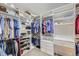 Spacious walk-in closet with custom shelving and hanging rods to organize clothing and shoes efficiently at 5350 Clearbrooke Ct, Castle Rock, CO 80104