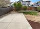 Well-maintained backyard showcasing a concrete patio area and a partially fenced yard at 10707 Milliken St, Parker, CO 80134