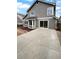 The backyard has a concrete patio with sliding glass doors for easy indoor-outdoor living at 10707 Milliken St, Parker, CO 80134