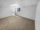 Finished basement featuring neutral carpet and a window, offering flexibility for various uses at 10707 Milliken St, Parker, CO 80134