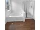 Bathroom featuring a tub and separate glass enclosed shower at 10707 Milliken St, Parker, CO 80134