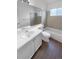A well-lit bathroom with a tiled shower, tub, and spacious vanity that creates a relaxing space at 10707 Milliken St, Parker, CO 80134