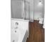 Bright bathroom featuring a soaking tub with shower and modern fixtures at 10707 Milliken St, Parker, CO 80134