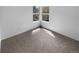 This bedroom has a neutral color palette and plush carpet, offering a cozy space at 10707 Milliken St, Parker, CO 80134