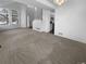 Spacious open-concept living room with natural light and views of kitchen at 10707 Milliken St, Parker, CO 80134