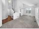Open-concept living space featuring soaring ceilings, large windows, and wood floors at 10707 Milliken St, Parker, CO 80134