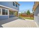 View of the deck and yard with a firepit and outdoor string lights in a well manicured backyard at 15437 W 95Th Ave, Arvada, CO 80007