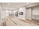 Finished basement with stylish flooring, modern fireplace, and convenient kitchenette at 15437 W 95Th Ave, Arvada, CO 80007