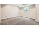 Bright basement bedroom with plush carpeting and a view of the outdoors at 15437 W 95Th Ave, Arvada, CO 80007
