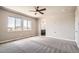 Bright bedroom with a ceiling fan and plush carpeting showcases a relaxing space at 15437 W 95Th Ave, Arvada, CO 80007