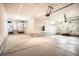 Spacious three car garage with sealed floors and plenty of storage space for vehicles and other items at 15437 W 95Th Ave, Arvada, CO 80007