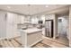Contemporary kitchen features stainless steel appliances and a stylish central island at 15437 W 95Th Ave, Arvada, CO 80007