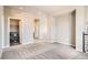 Spacious living room with laundry room and other rooms visible, creating a functional and versatile space at 15437 W 95Th Ave, Arvada, CO 80007