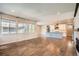 Open concept living space featuring a modern kitchen, living room and beautiful hardwood floors at 15437 W 95Th Ave, Arvada, CO 80007