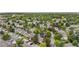Aerial view of a residential neighborhood, highlighting tree-lined streets and a community pool at 3050 W 107Th Pl # E, Westminster, CO 80031