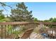 Balcony featuring two chairs with views of a community pool and lush greenery at 3050 W 107Th Pl # E, Westminster, CO 80031