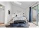 Bedroom with a comfortable bed, modern decor, and access to a private balcony at 3050 W 107Th Pl # E, Westminster, CO 80031
