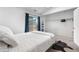 Bedroom featuring a bed and sliding glass door to outdoor space at 3050 W 107Th Pl # E, Westminster, CO 80031