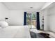 Bedroom featuring a cozy bed and sliding door to outdoor space at 3050 W 107Th Pl # E, Westminster, CO 80031