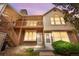 Inviting exterior showcasing the home's multi-level deck and stone facade at twilight, adding charm and curb appeal at 3050 W 107Th Pl # E, Westminster, CO 80031