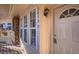 Close up of the front door, showcasing the house number and a glimpse of the welcoming porch at 3050 W 107Th Pl # E, Westminster, CO 80031