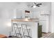 Bright kitchen with breakfast bar and white appliances at 3050 W 107Th Pl # E, Westminster, CO 80031