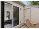 Outdoor patio with seating, accessible via sliding glass door to the bedroom with bright interior view at 3050 W 107Th Pl # E, Westminster, CO 80031
