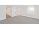 Bedroom features neutral carpet and natural light from a window at 300 N Inca St, Denver, CO 80223