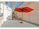 Backyard patio featuring an orange umbrella and seating at 300 N Inca St, Denver, CO 80223