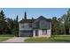Charming two-story home boasts a modern design with stone accents and a well-manicured lawn at 15295 Fillmore St, Thornton, CO 80602